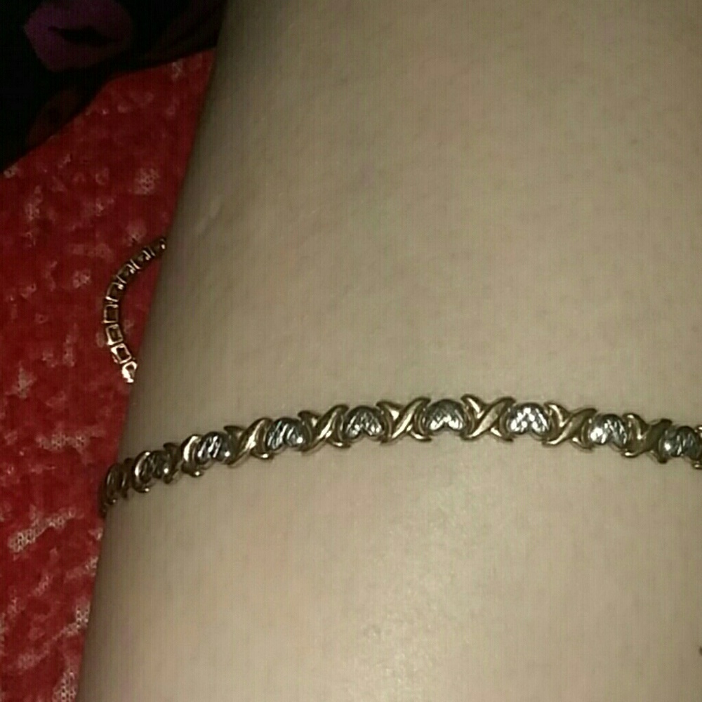 10 k gold bracelet with silver hearts and gold x